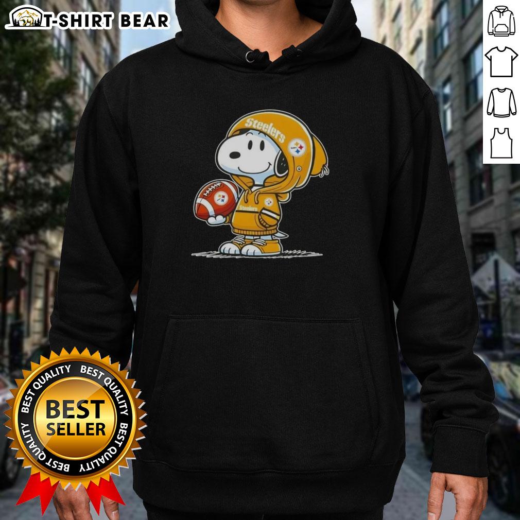 Alt Text: Snoopy in a hoodie, smiling at fans, showcasing his Pittsburgh Steelers spirit in this official Peanuts image.