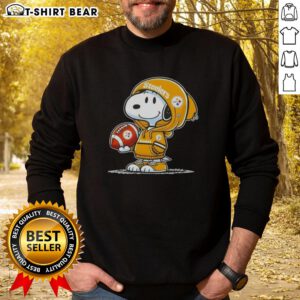 Snoopy wearing a Pittsburgh Steelers hoodie, smiling at fans in an official Peanuts sweatshirt.