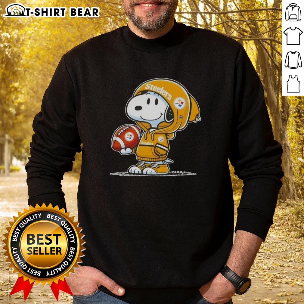Snoopy wearing a Pittsburgh Steelers hoodie, smiling at fans in an official Peanuts sweatshirt.