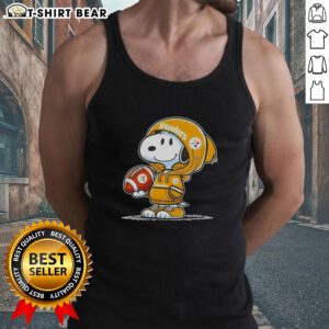 Alt Text: Snoopy in a hoodie supporting the Pittsburgh Steelers, smiling at fans while wearing a tank top. Official Peanuts merchandise.