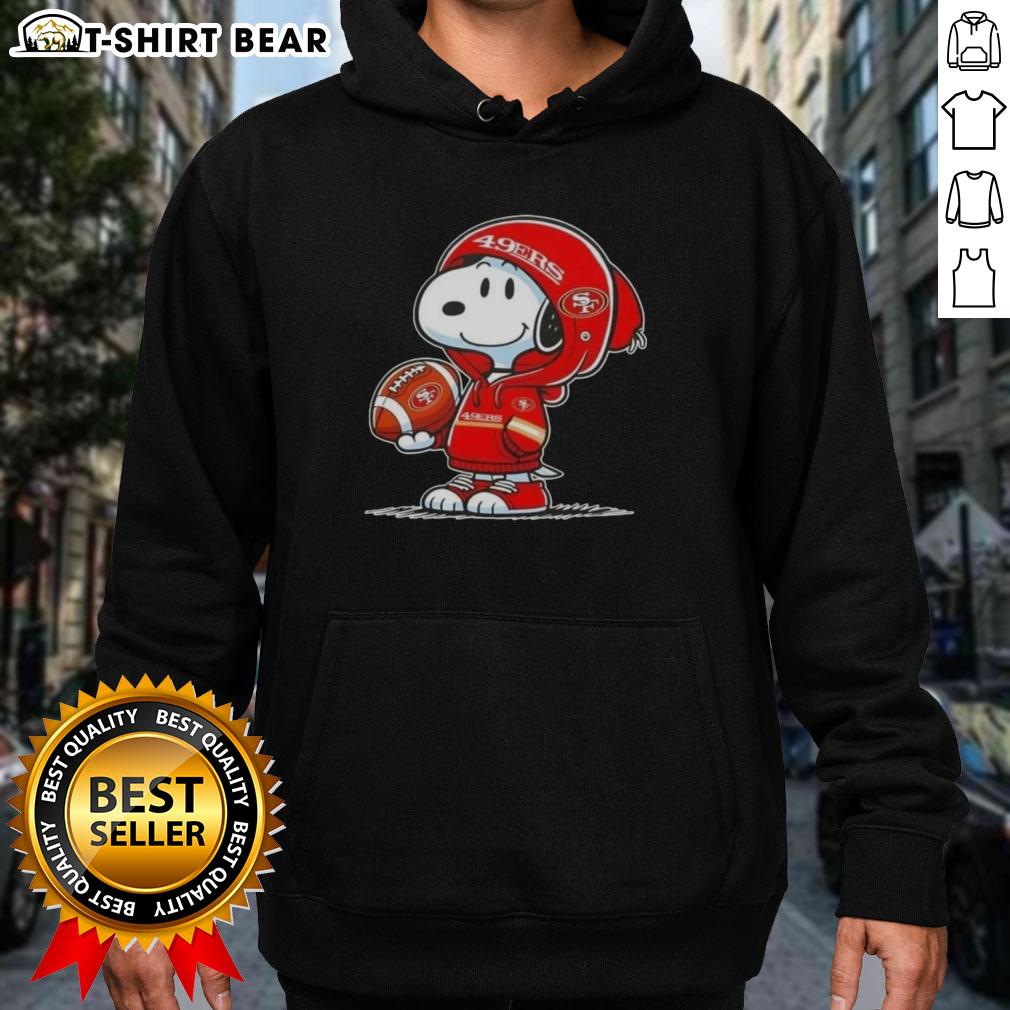 Snoopy in a San Francisco 49ers hoodie, smiling at fans at an event, showcasing Peanuts character charm.