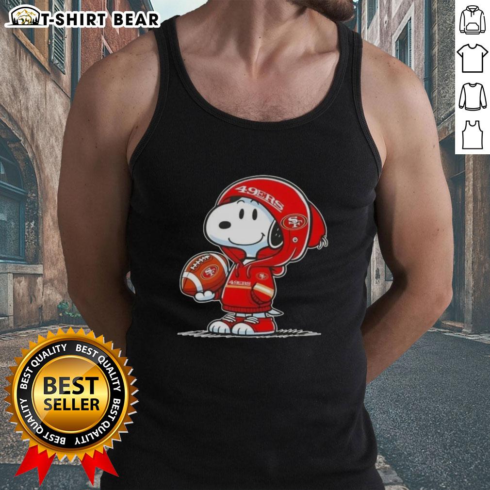 Snoopy in a hoodie smiles at fans in San Francisco 49ers tank top, showcasing official Peanuts merchandise.