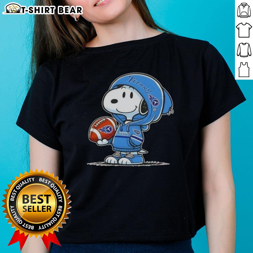 Official Peanuts Snoopy wearing Tennessee Titans hoodie, smiling at fans on a ladies tee, perfect for sports enthusiasts.