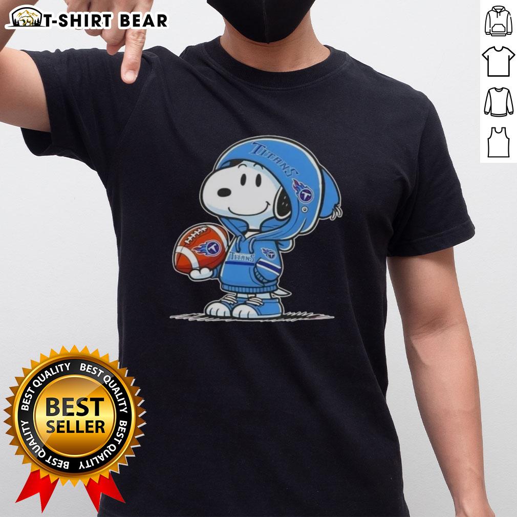 Snoopy wearing a Tennessee Titans hoodie smiles at fans on a fun graphic t-shirt featuring Peanuts characters.