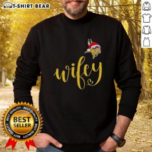 Alt Text: Pretty Wifey Minnesota Vikings Santa Hat Merry Christmas Sweatshirt featuring festive design and team colors for holiday spirit.