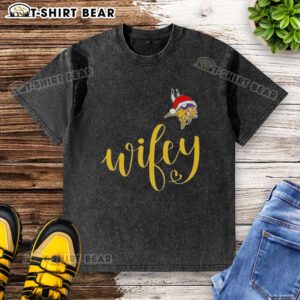Pretty Wifey Minnesota Vikings Santa Hat Merry Christmas washed t-shirt featuring festive design and team colors.