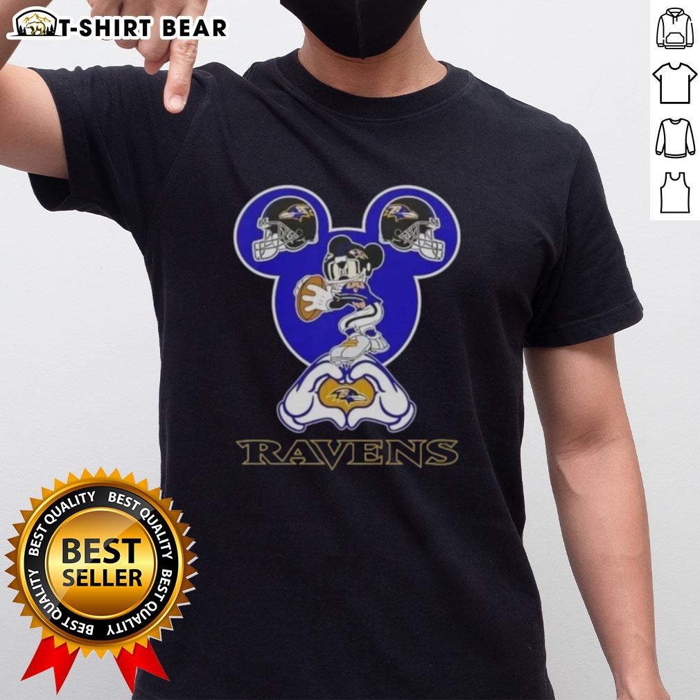 Alt Text: Top Mickey hands forming a heart on a Baltimore Ravens football T-shirt design, perfect for fans and love of the game.