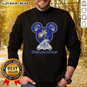 Seattle Seahawks sweatshirt featuring top Mickey hands forming a heart, perfect for fans showing love for football.