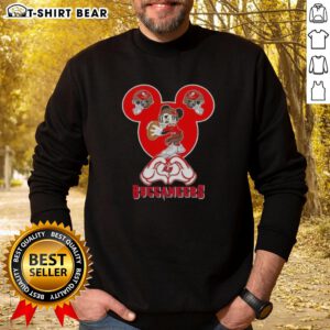 Cozy Tampa Bay Buccaneers football sweatshirt featuring Mickey Hands forming a heart, perfect for fans and love for the team.