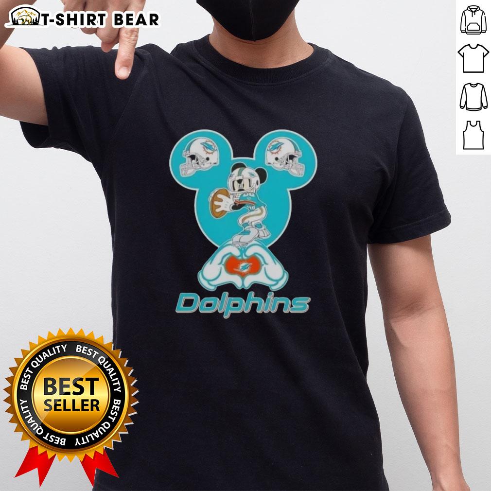 Alt Text: Top Mickey Hands Heart Miami Dolphins Football T-Shirt design featuring iconic Mickey Mouse gloves and a heart.