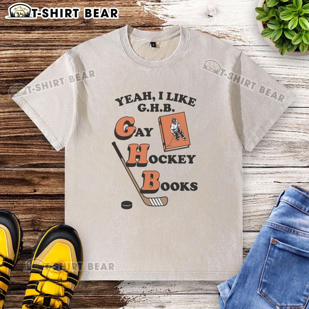 Funny Yeah I Like G.H.B. Gay Hockey Books washed t-shirt featuring a vibrant graphic design and playful text.
