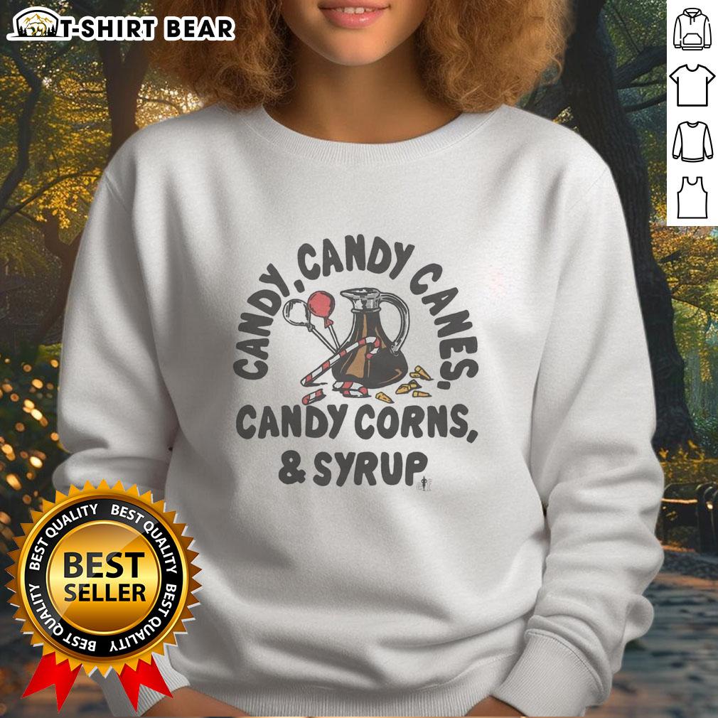 Good Candy sweatshirt featuring candy canes, candy corns, and syrup design for festive holiday wear.