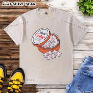 Good Diet Coke Zyn pouches displayed on a washed t-shirt, showcasing a casual style and lifestyle accessory.