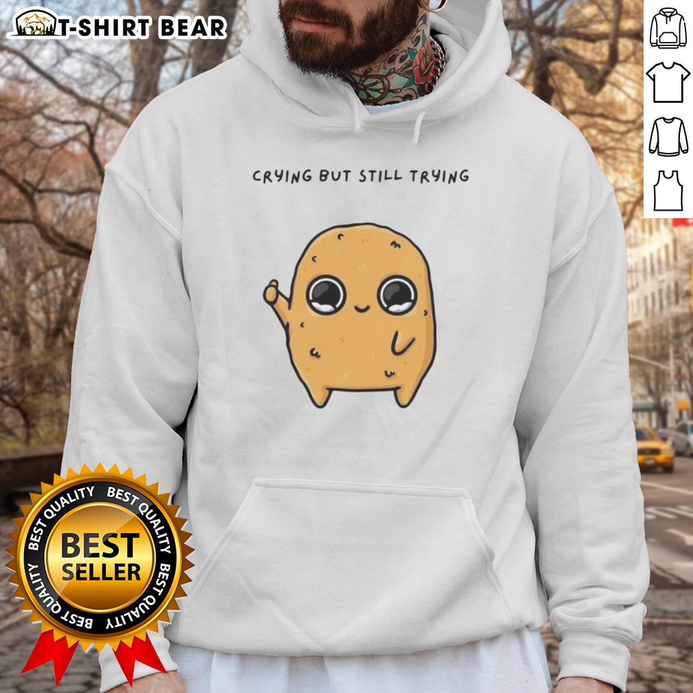 Good Sad Nuggie mascot cartoon in a hoodie, crying but trying to smile, perfect for a heartwarming design.