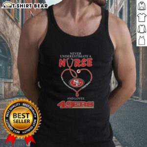 Alt Text: Nurse in a tank top supporting San Francisco 49ers football, showcasing love for the team and the sport.