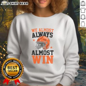 Funny football fan sweatshirt with 'Good We Almost Always Almost Win' slogan, perfect for game day and sports enthusiasts.