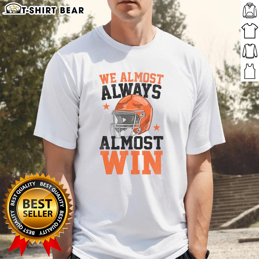 Funny football fan T-shirt with 'Good We Almost Always Almost Win' slogan, perfect for sports enthusiasts and game day.