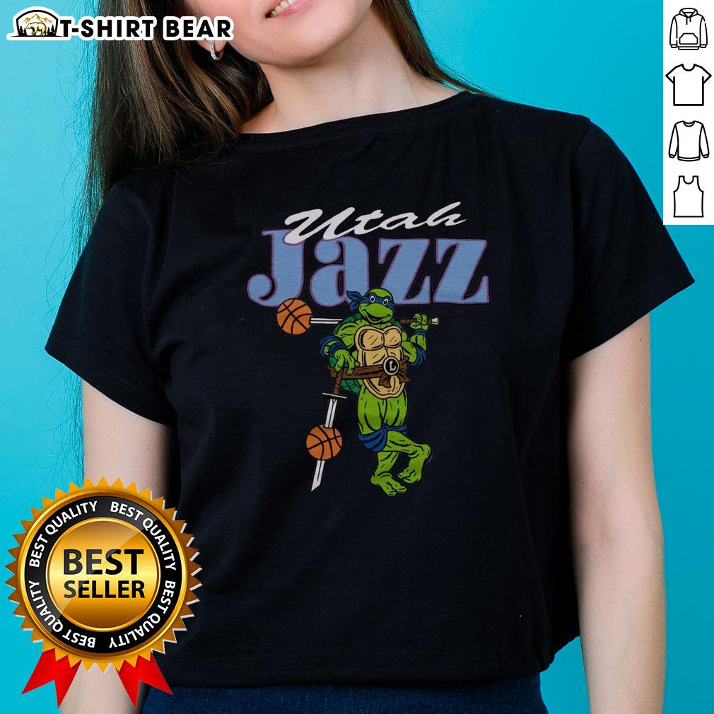 Happy TMNT Leonardo wearing a Utah Jazz ladies tee, blending pop culture with sports fashion for a fun look.