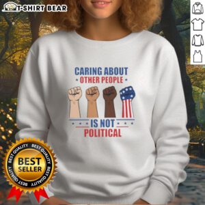 Nice Caring About Other People Is Not Political Fists Sweatshirt in a cozy, casual style showcasing a bold message.
