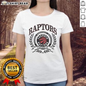 Vintage Toronto Raptors logo in a laurel wreath frame on a ladies' tee, perfect for NBA fans and retro apparel lovers.