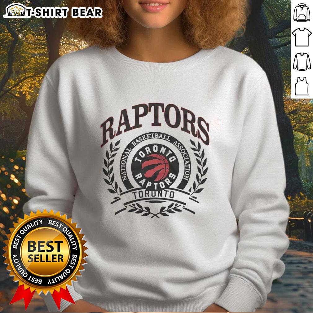Alt Text: Retro Toronto Raptors sweatshirt featuring the NBA logo framed by a laurel wreath design. Perfect for fans!