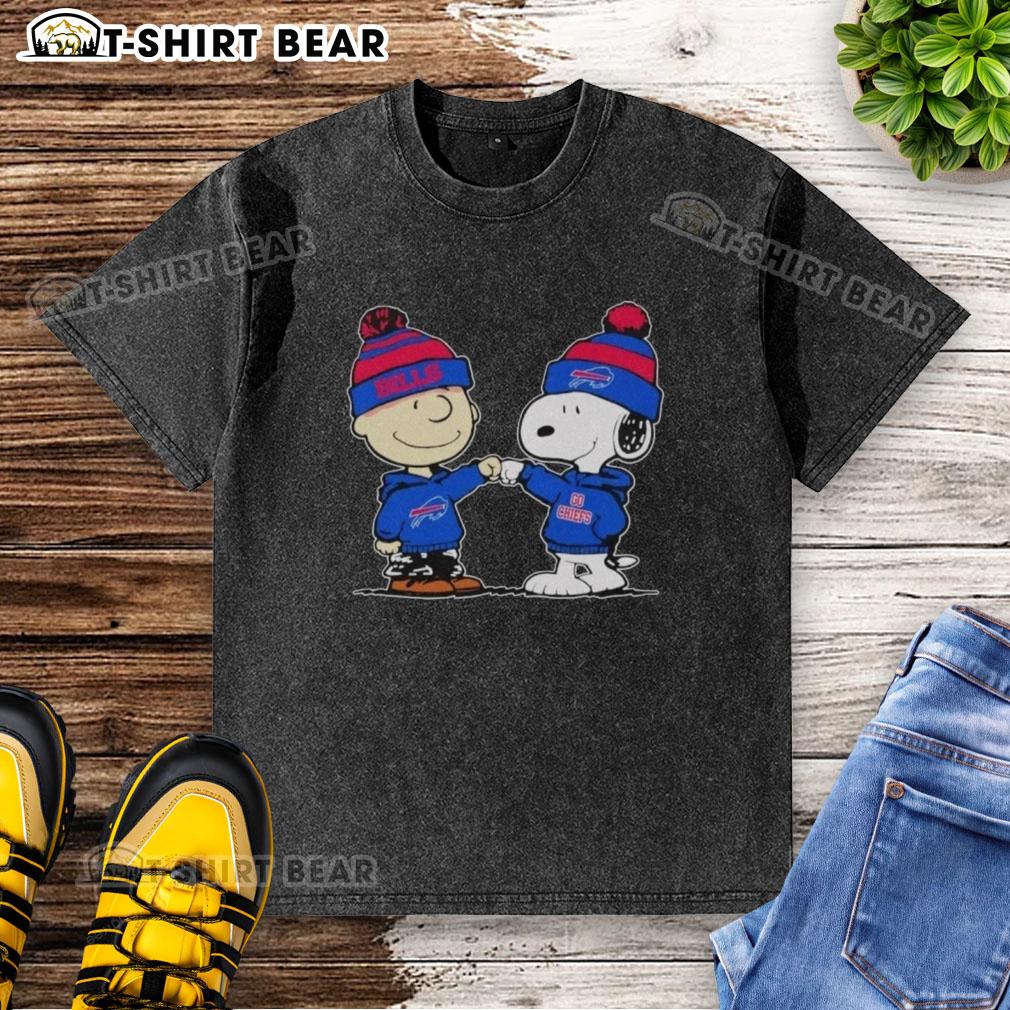Alt Text: Official Buffalo Bills Snoopy and Charlie Brown Best Friends washed t-shirt featuring vibrant graphics and soft fabric.