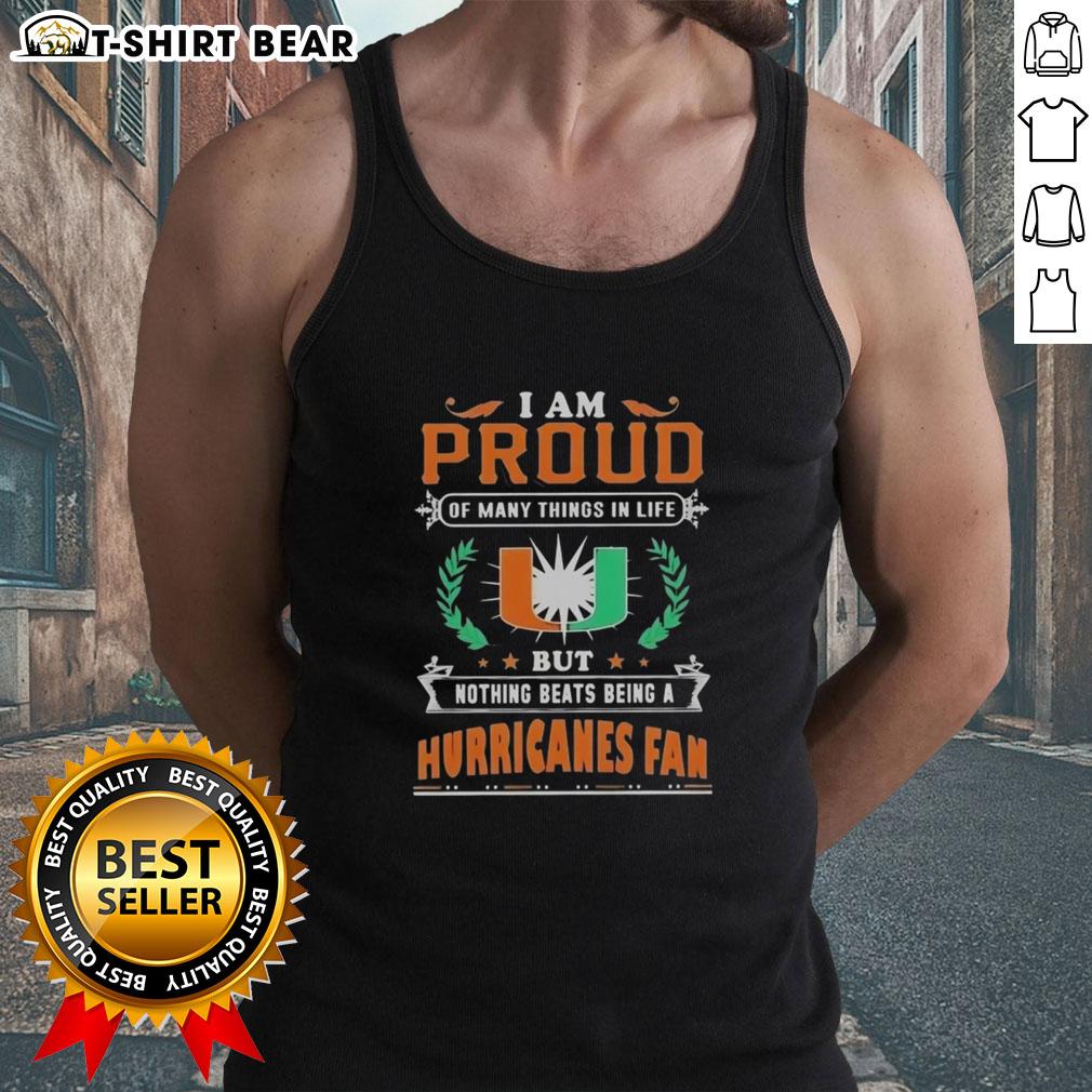Alt Text: Miami Hurricanes fan wearing a tank top that says 'I Am Proud Of Many Things In Life' showcasing football love.