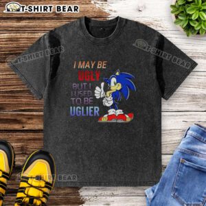 Cartoon hedgehog on washed T-shirt with 'I May Be Ugly But I Used To Be Uglier' slogan, perfect for quirky fashion.