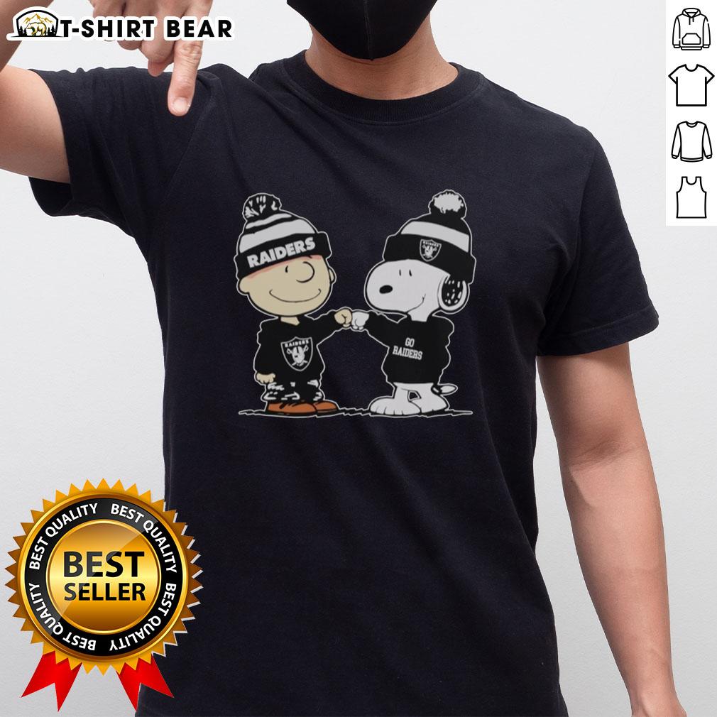 Alt Text: Official Los Angeles Raiders Snoopy and Charlie Brown Best Friends T-Shirt featuring iconic cartoon characters and team logo.
