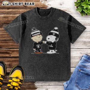 Official Los Angeles Raiders Snoopy and Charlie Brown Best Friends washed t-shirt featuring iconic cartoon characters.