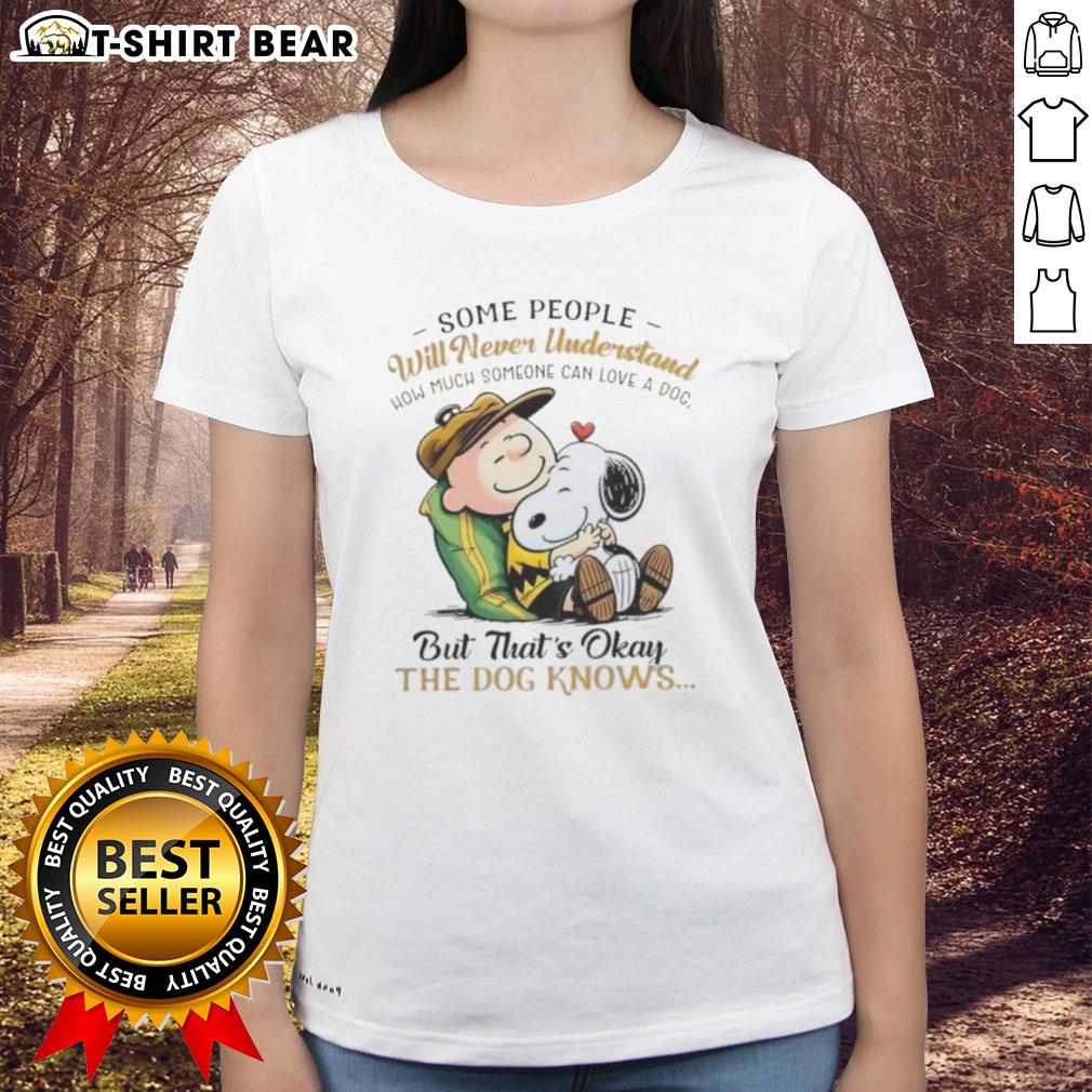 Alt Text: Official Snoopy and Charlie Brown ladies tee featuring a heartfelt quote about love for dogs.