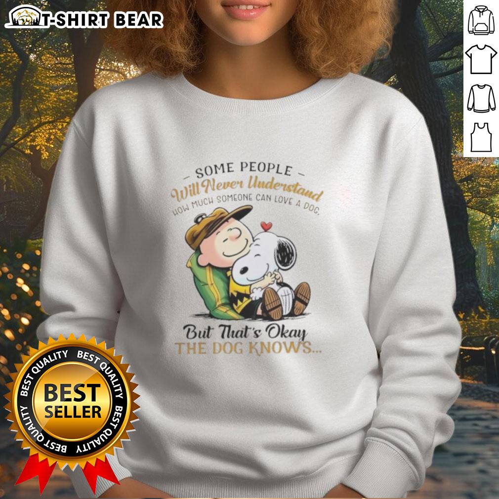 Alt Text: Cozy sweatshirt featuring Snoopy and Charlie Brown with the quote about loving a dog, perfect for dog lovers.