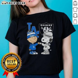 Alt Text: Original Charlie Brown fist bump with Snoopy, celebrating Los Angeles City sports, Dodgers, and Raiders on a ladies' tee.