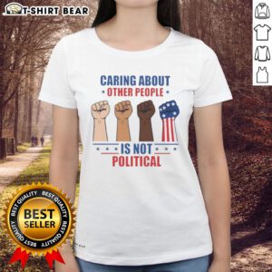 Premium ladies tee featuring 'Caring About Other People Is Not Political' with a fist graphic for social awareness.
