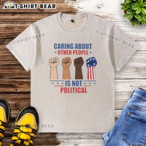 Premium 'Caring About Other People Is Not Political' Fists Washed T-Shirt, featuring a bold graphic design on a soft fabric.