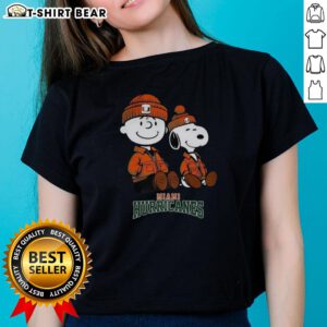 Alt Text: Premium Charlie Brown and Snoopy Miami Hurricanes ladies tee featuring vibrant colors and stylish design for fans.