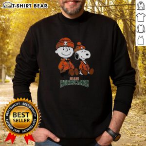 Premium Charlie Brown and Snoopy Miami Hurricanes sweatshirt featuring vibrant graphics and cozy design for fans.