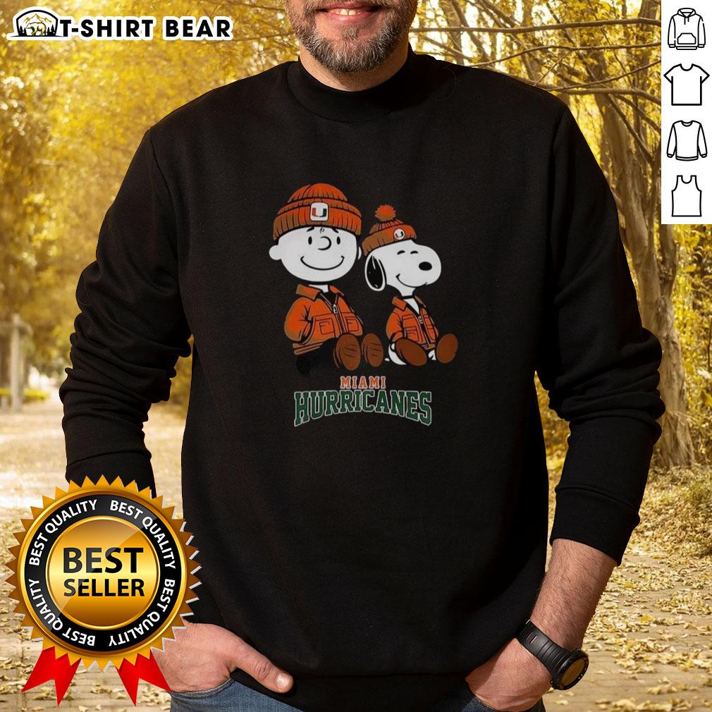 Premium Charlie Brown and Snoopy Miami Hurricanes sweatshirt featuring vibrant graphics and cozy design for fans.