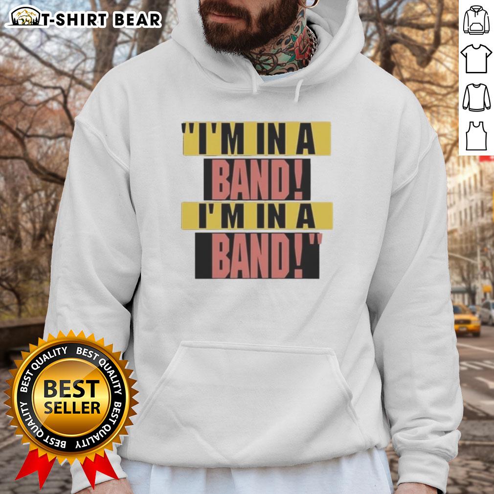 Alt Text: Hayley Williams wearing I'm In A Band hoodie, showcasing her stylish look and vibrant personality.