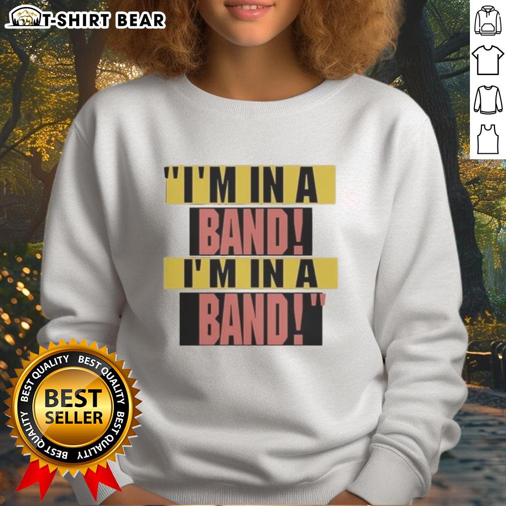 Hayley Williams wearing 'I'm In A Band' sweatshirt, showcasing her unique style and vibrant personality.