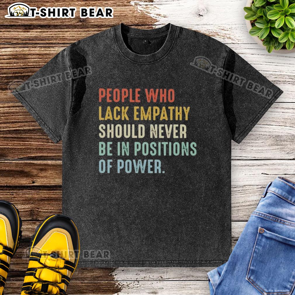 Pretty people wearing 'Empathy-less Power' t-shirt, highlighting the importance of empathy in leadership roles.