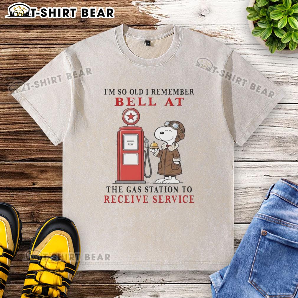 Alt Text: Vintage Snoopy t-shirt featuring the phrase about remembering gas station service bells, perfect for nostalgic fans.