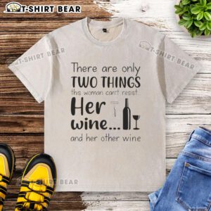 Woman enjoying her wine while wearing a witty 'I can't resist my wine' washed t-shirt, showcasing her playful personality.