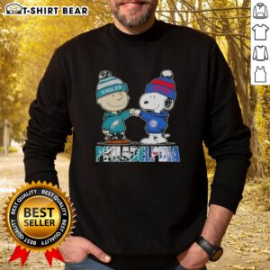 Top Charlie Brown and Snoopy Philadelphia City Sports Eagles X 76ers sweatshirt featuring iconic characters in vibrant colors.