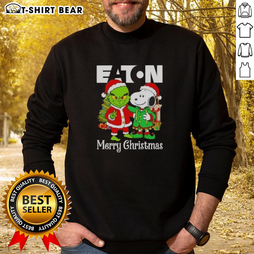 Top Eaton Corporation X Grinch and Snoopy Merry Christmas sweatshirt featuring colorful holiday designs and festive graphics.