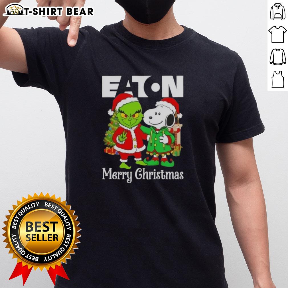 Alt Text: Top Eaton Corporation X Grinch and Snoopy Merry Christmas T-Shirt featuring festive holiday design and vibrant colors.
