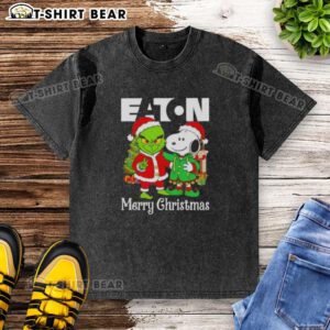 Top Eaton Corporation X Grinch and Snoopy Merry Christmas washed t-shirt featuring festive graphics and vibrant colors.
