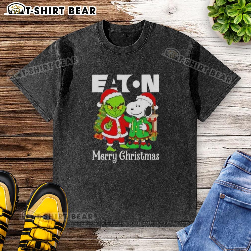 Top Eaton Corporation X Grinch and Snoopy Merry Christmas washed t-shirt featuring festive graphics and vibrant colors.