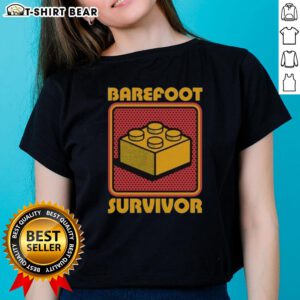 Top Foot Brick Survivor Barefoot Lego Survivor Ladies Tee featuring a playful graphic for Lego enthusiasts.