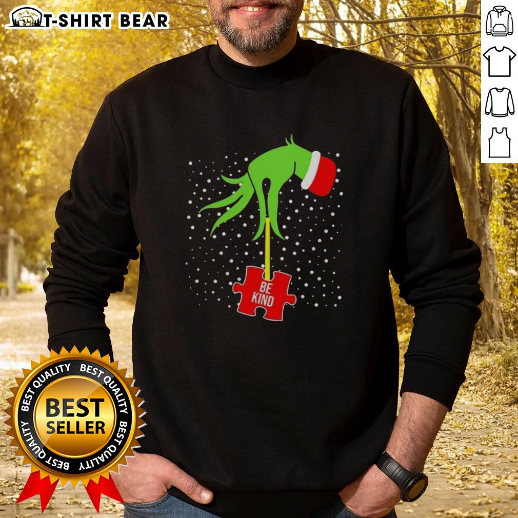 Top Grinch Hand Be Kind Puzzle Autism Awareness Christmas Sweatshirt featuring festive design and vibrant colors.